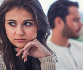 Couple, looking disconnected from each other